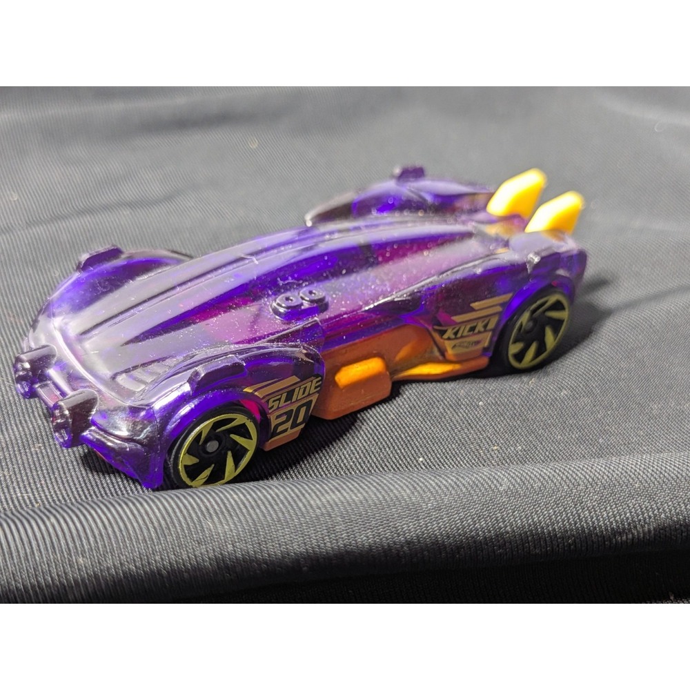Hot Wheels Slide Kick diecast car! Features a‎ translucent purple body
